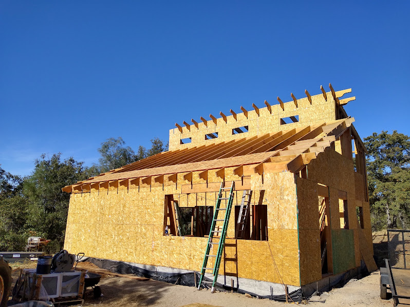 Sheathing started on the structure with openings framed